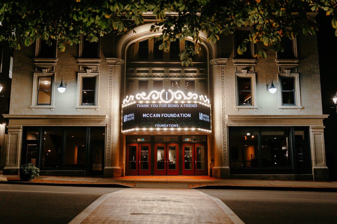 Theatre picture taken straight, it is white and lit up in the dark