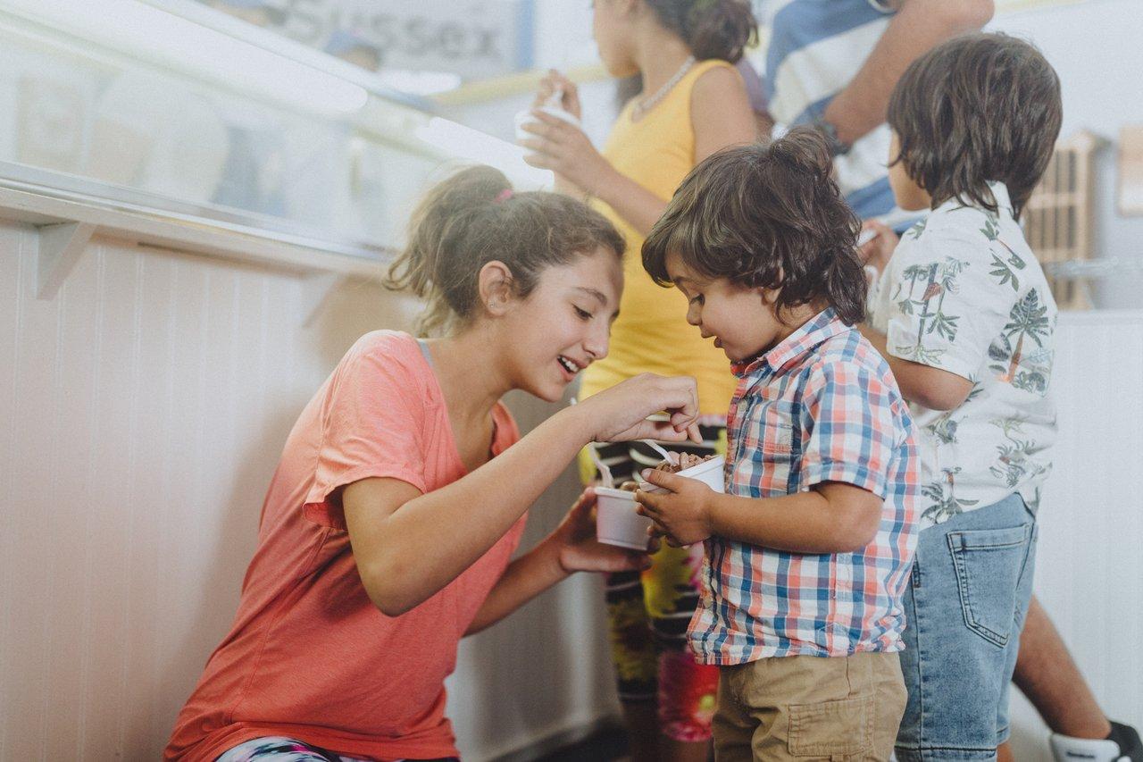 Kids enjoying icecream at parlour