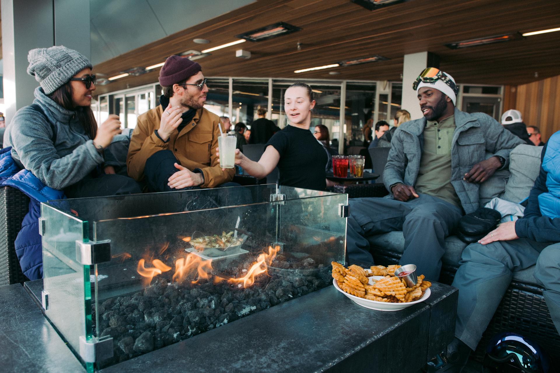 Group of friends enjoying après at the Garibaldi Lift Company in Whistler