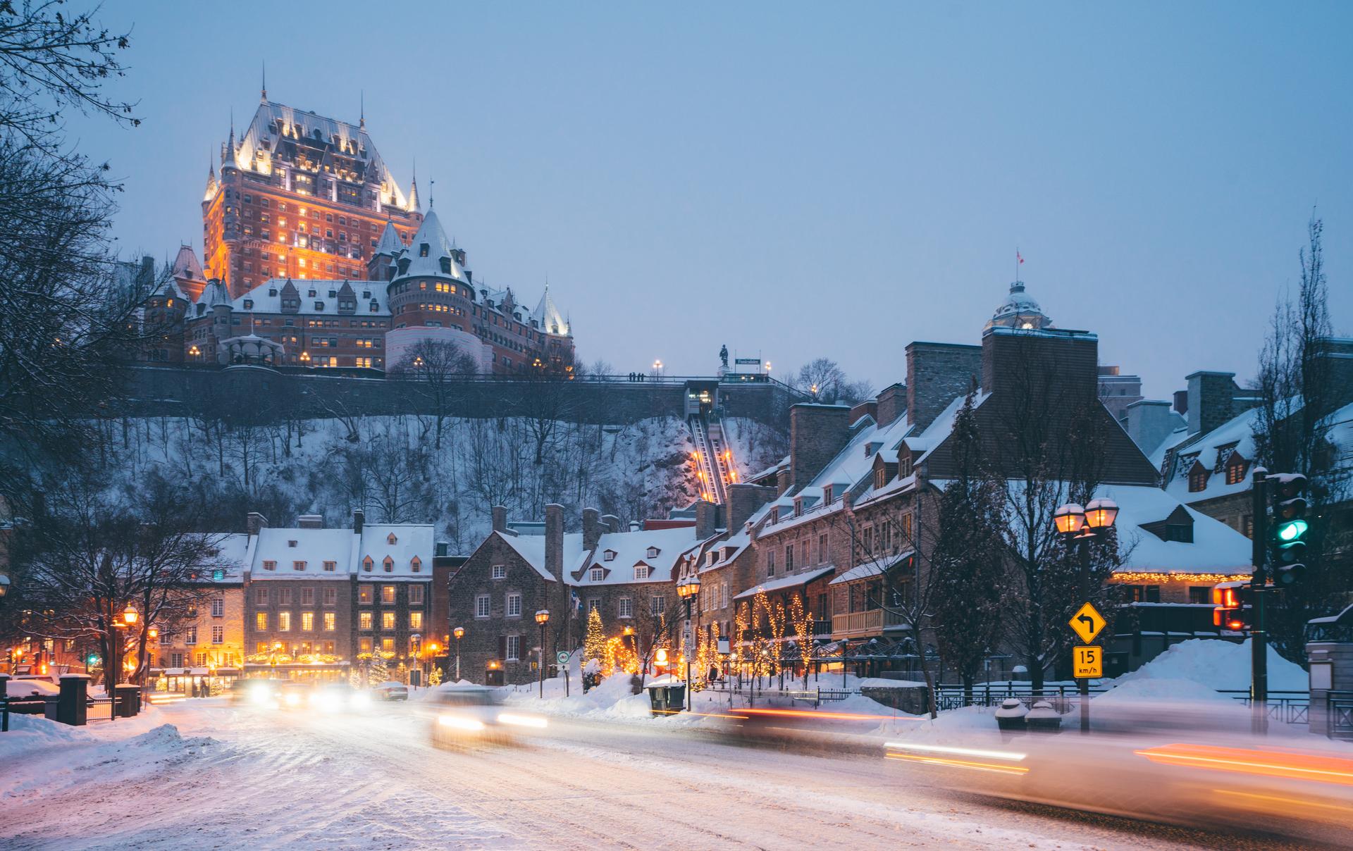 Evening winter scene of Old Québec with Château Frontenac illuminated on the hill