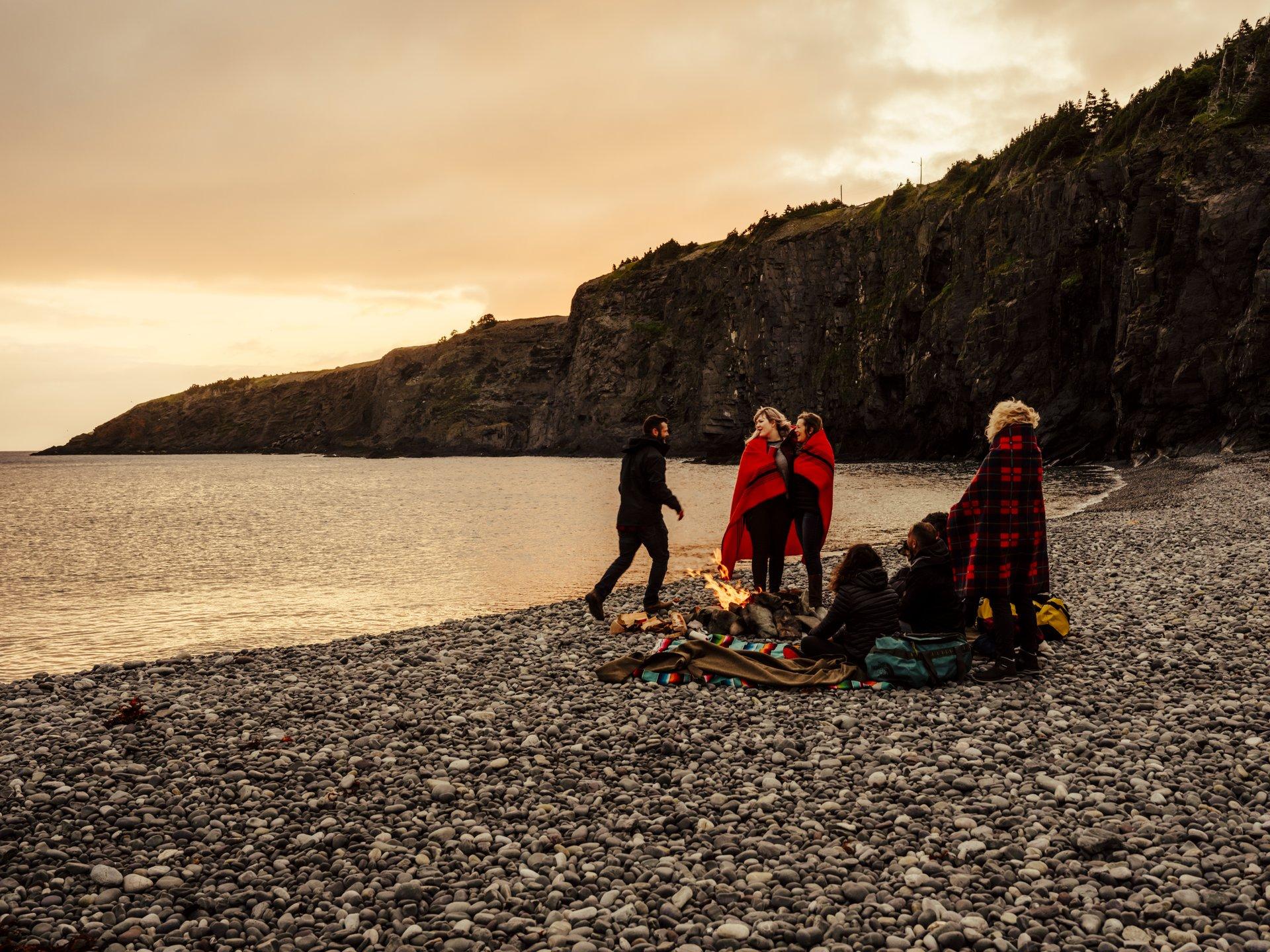 people hanging out at middle cove beach