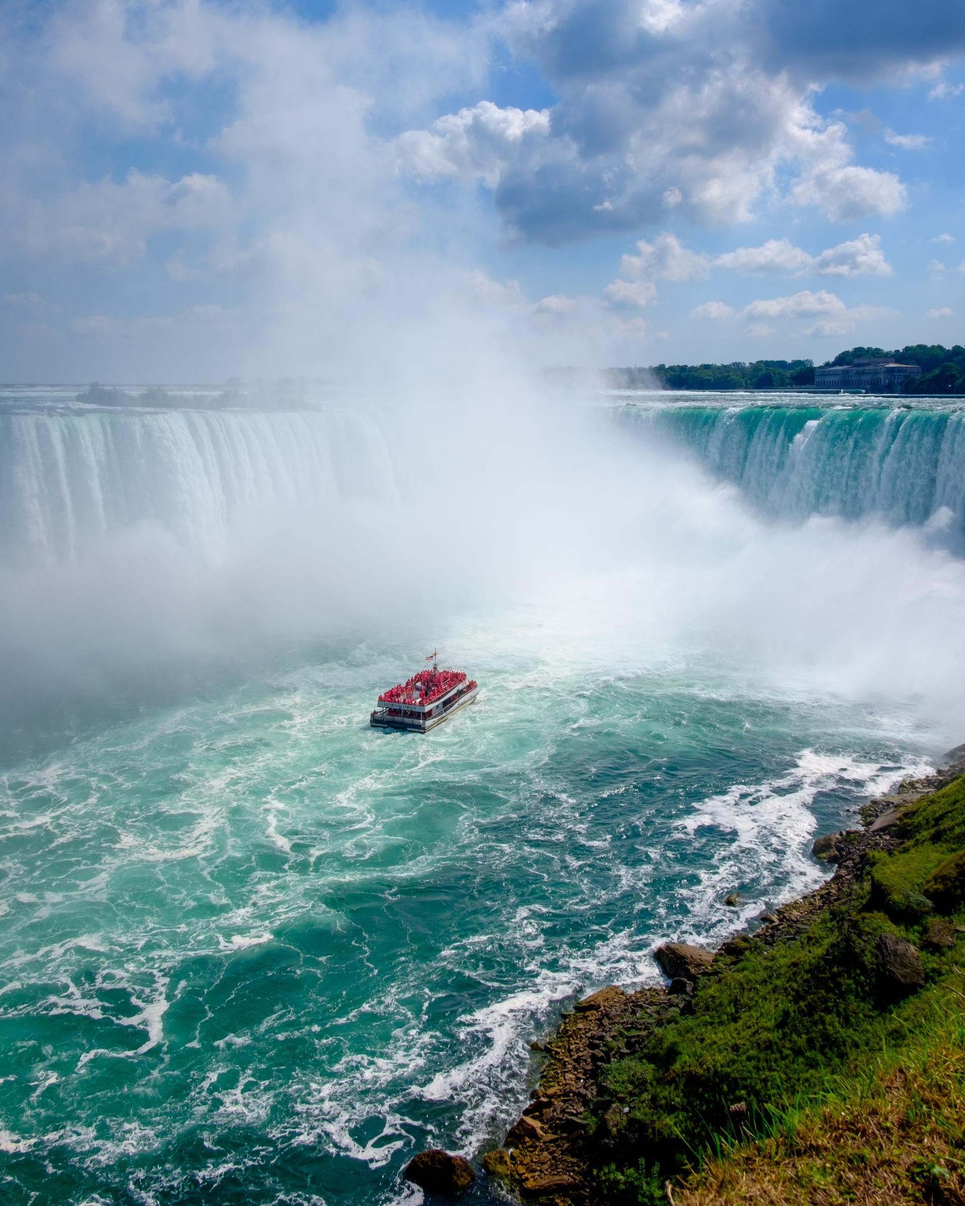 A boat travelling past Niagara Falls in Ontario