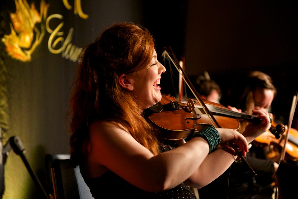 A group of fiddlers play traditional Nova Scotian music