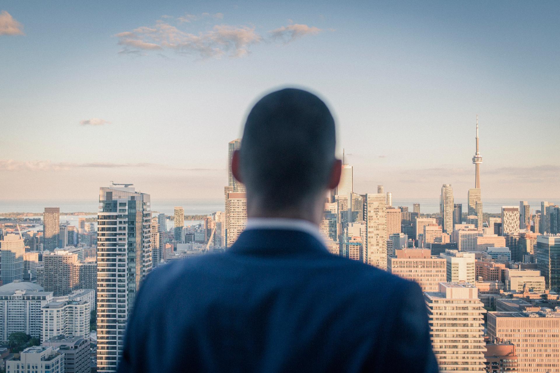 Fred Siriex stands in profile of the Toronto skyline