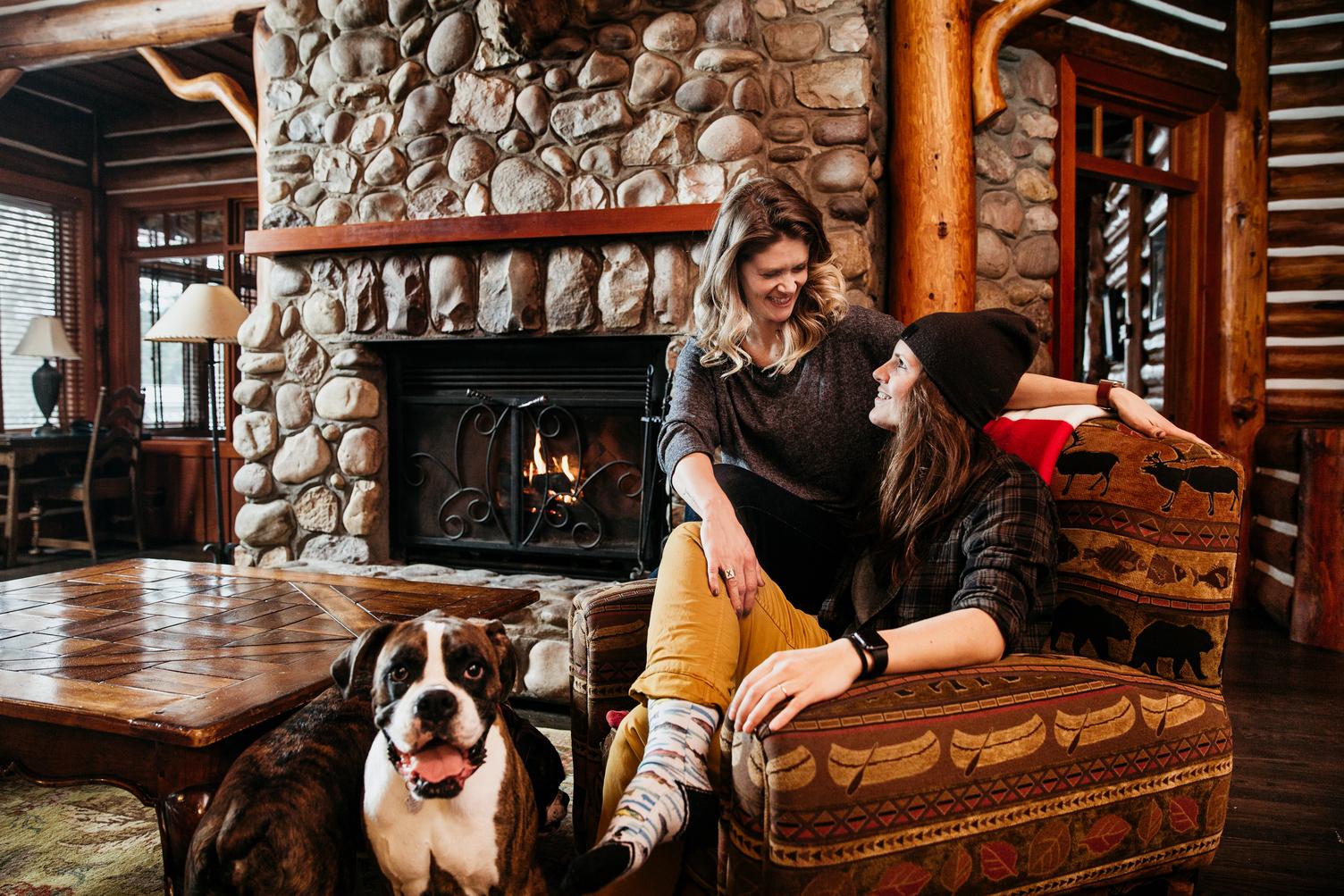 A couple and their dog relaxes at Jasper Park Lodge