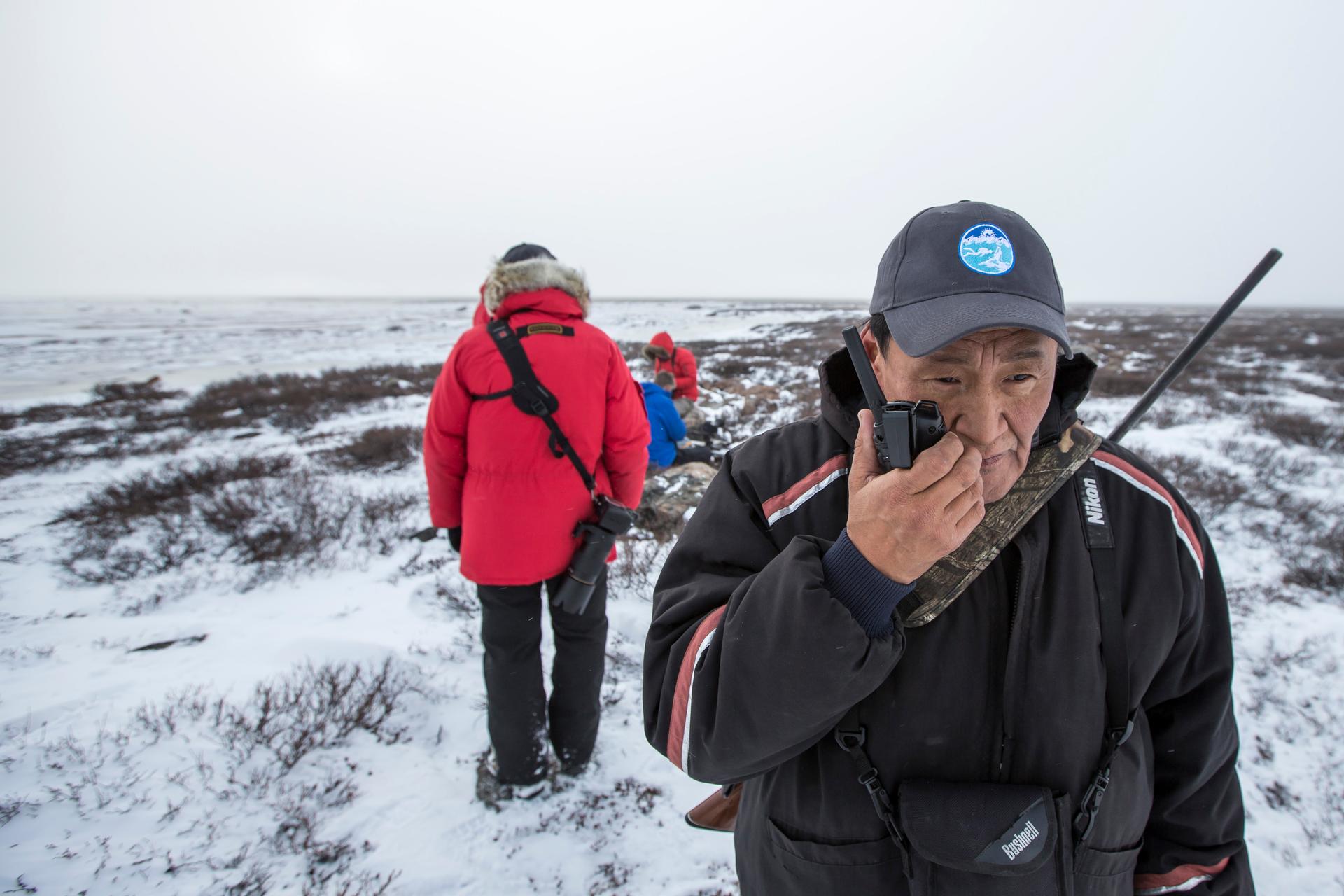 Expert hunters in Nunavut talk with walkies talkies