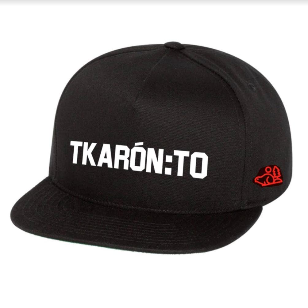 A black hat with the Mohawk word “Tkaronto,” Toronto’s original name