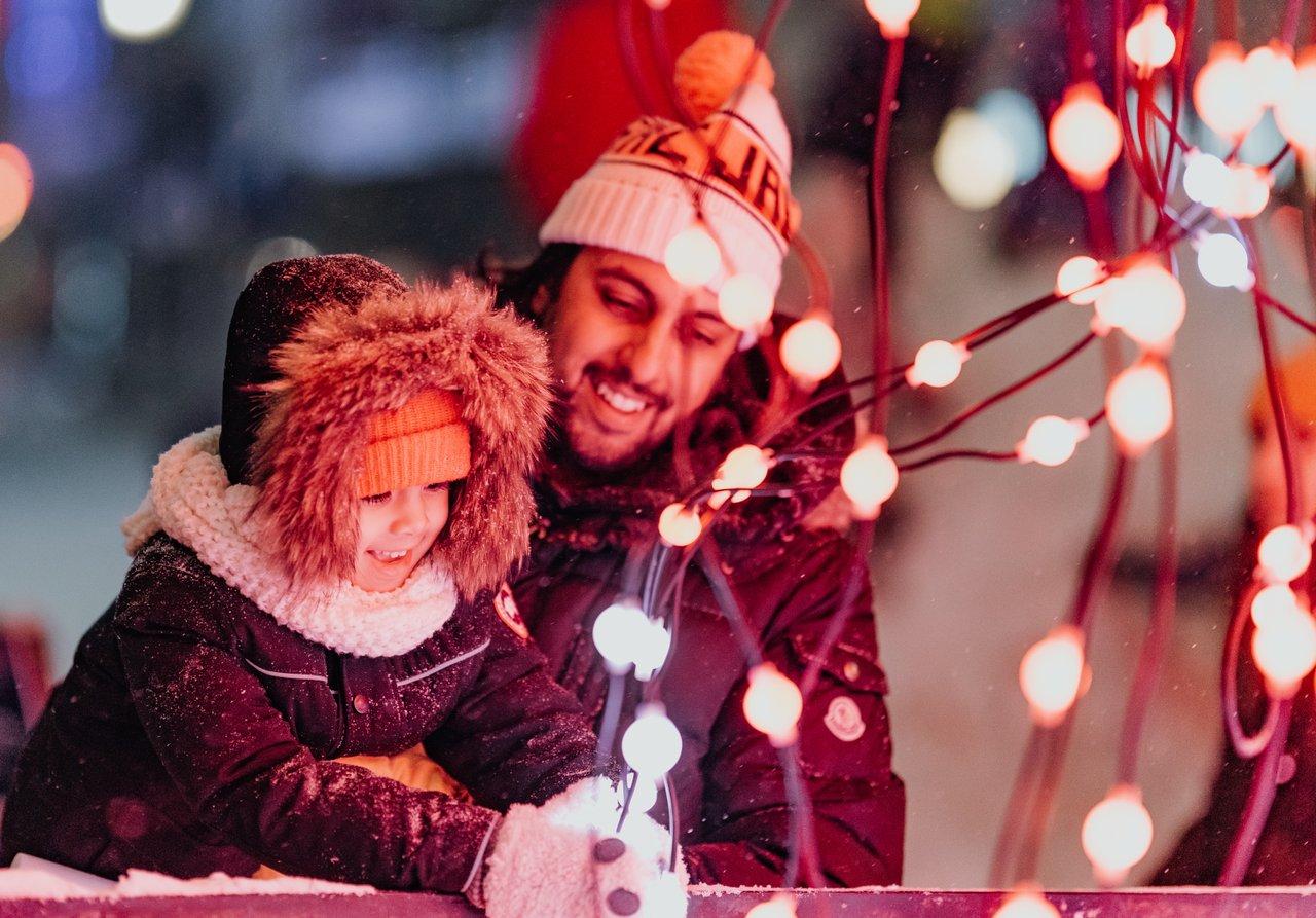 A father and daughter enjoy the lights at the Glow Festival