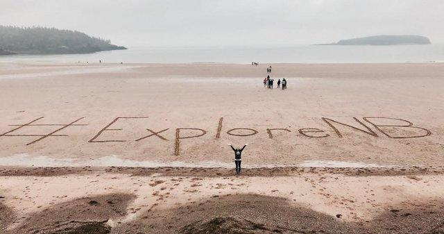 EXPLORE NB written in the sand
