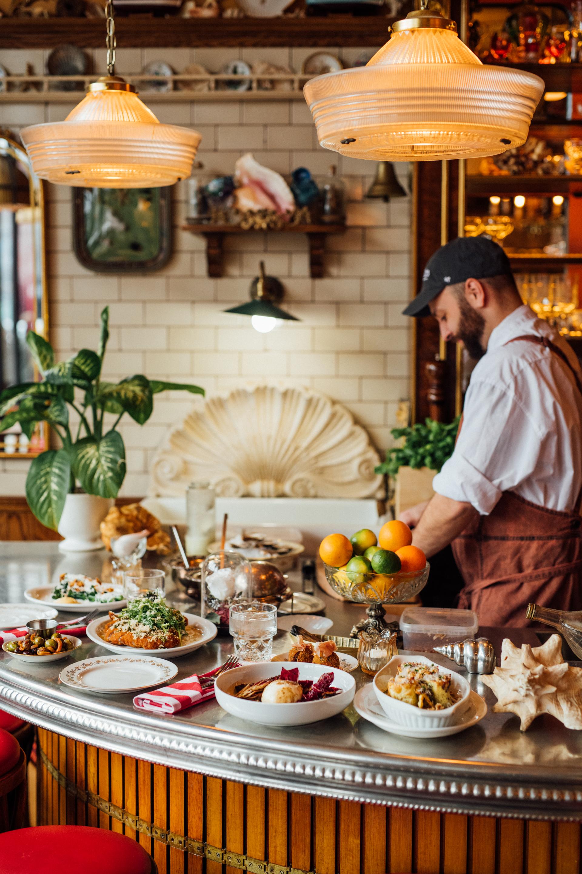 A chef preparing dishes in a restaurant
