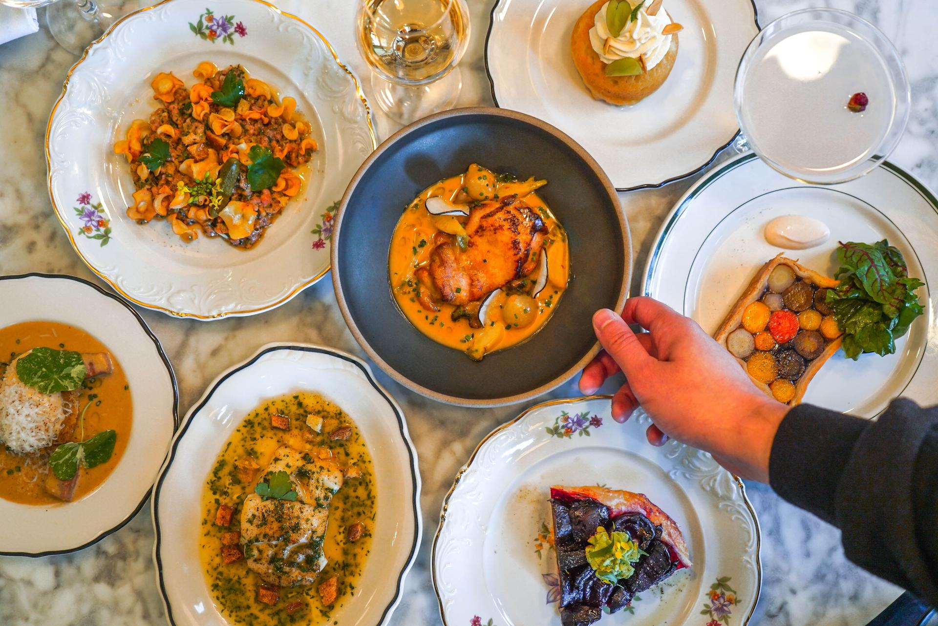 An overhead shot of various plates of food at Darna Bistroquet in Montreal.