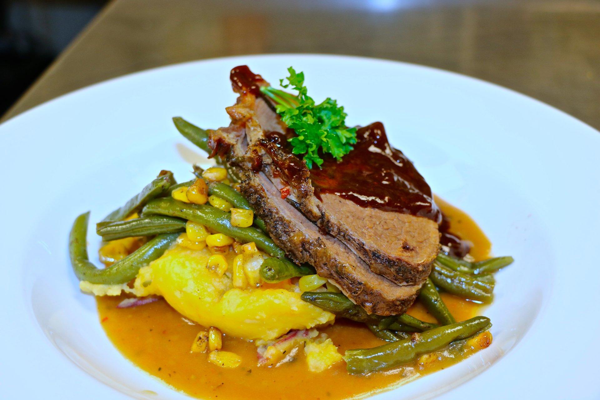 Braised bison roast with mashed vegetables