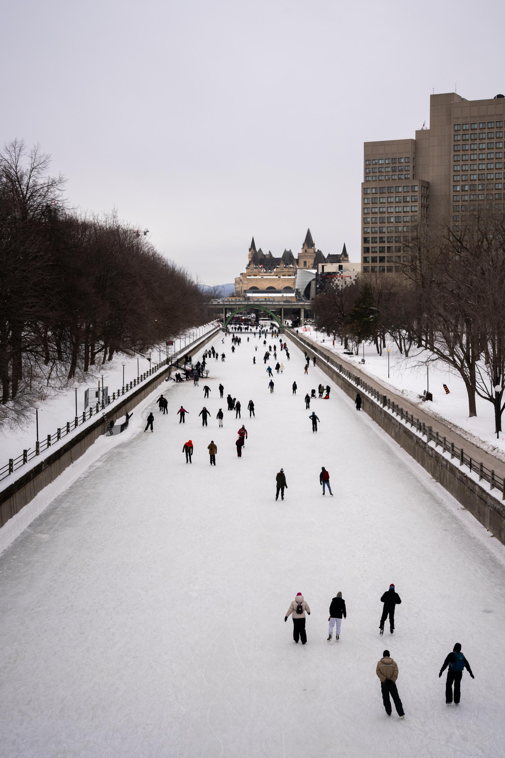People skating on the frozen Rideau Canal in Ottawa during winter