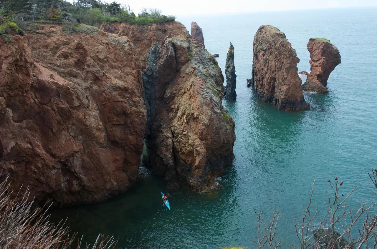 Hero image that establishes the Bay of Fundy as a rugged coastal landscape shaped by extreme tides, setting context for the article’s ‘8 ways’ activity list.
