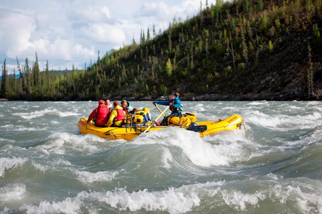 Illustrates rafting on the South Nahanni below Virginia Falls, supporting the article’s explanation of canyons, big drops, and why guided rafting is accessible even to novices.