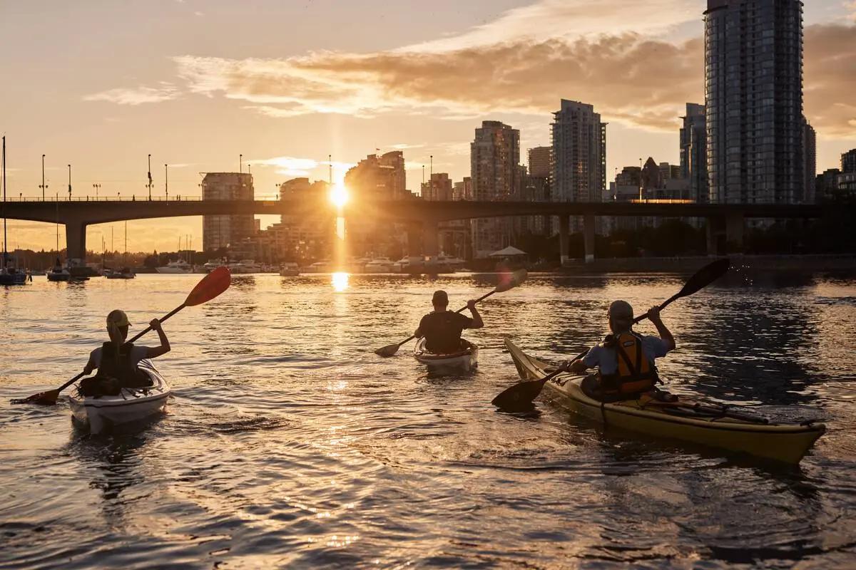 Hero image that frames the article’s premise—British Columbia experienced from the water—using an urban paddling scene in Vancouver’s False Creek to signal that water-based exploration can be both city and wilderness.