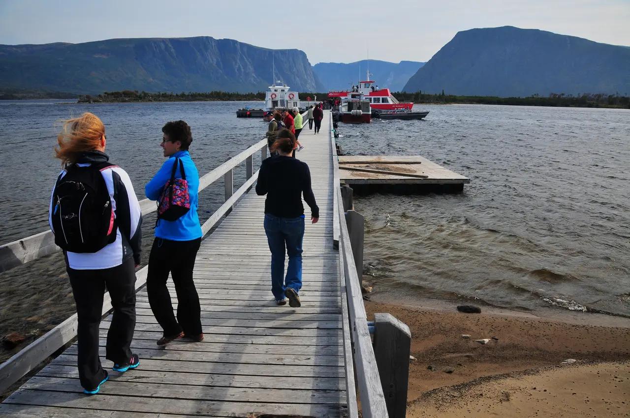 Option 1 visual proof point: reaching the dock after the 3 km trail still delivers a ‘fjords-and-cliffs’ payoff—helps readers decide if a hike-only visit is enough without committing to a boat tour.