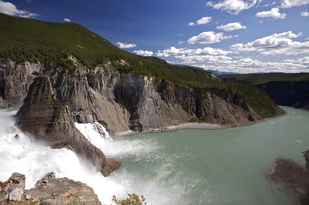 A sweeping view of Virginia Falls plunging into a canyon on the Nahanni River—an immediate cue that this article is about dramatic, remote wilderness experiences.