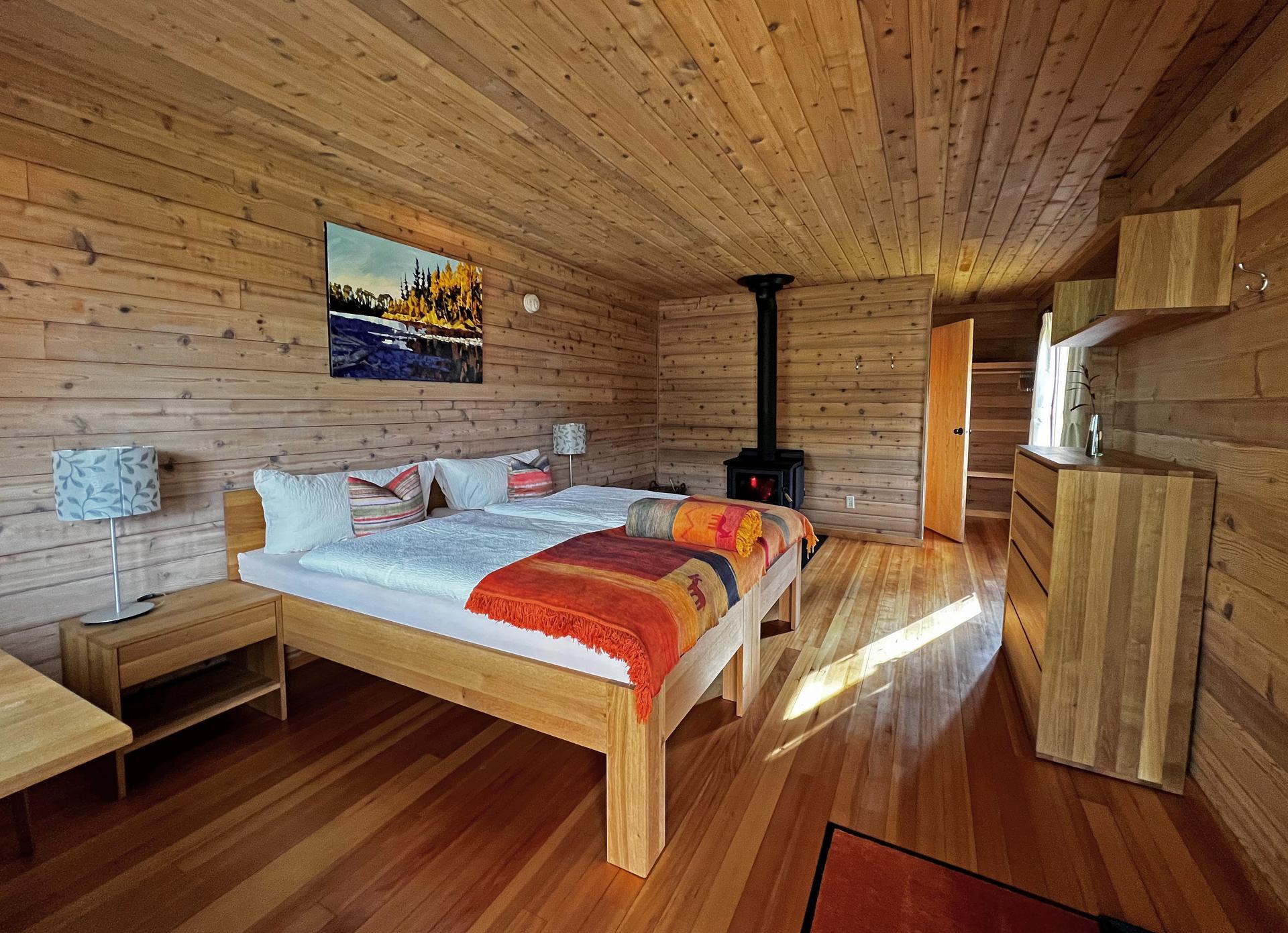 Rustic but comfortable cabin interior at Tincup Lodge with real bed and propane heat
