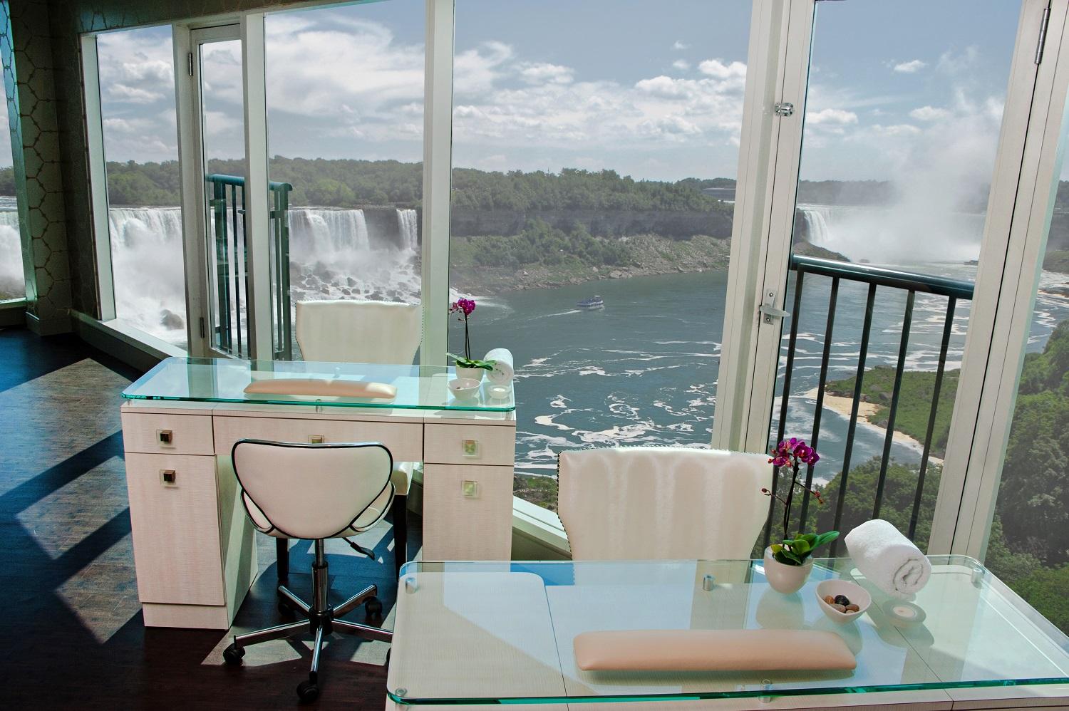 Manicure stations at Christienne Fallsview Spa with floor-to-ceiling windows overlooking the Canadian Horseshoe Falls and American Falls, Niagara Falls, Ontario