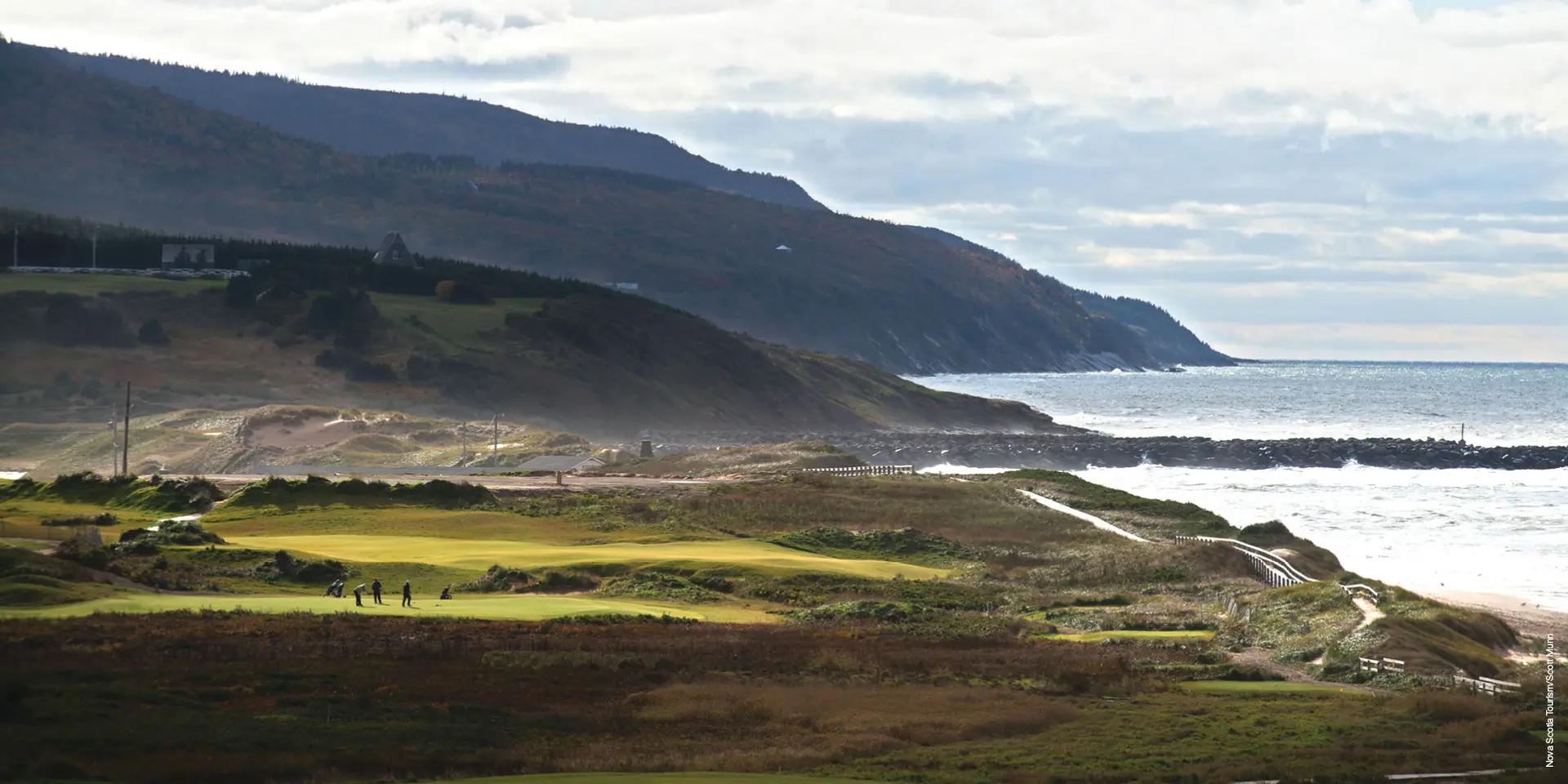 Cabot Links golf course in Inverness, Cape Breton Island, with fairways along the Gulf of St. Lawrence and highland cliffs beyond