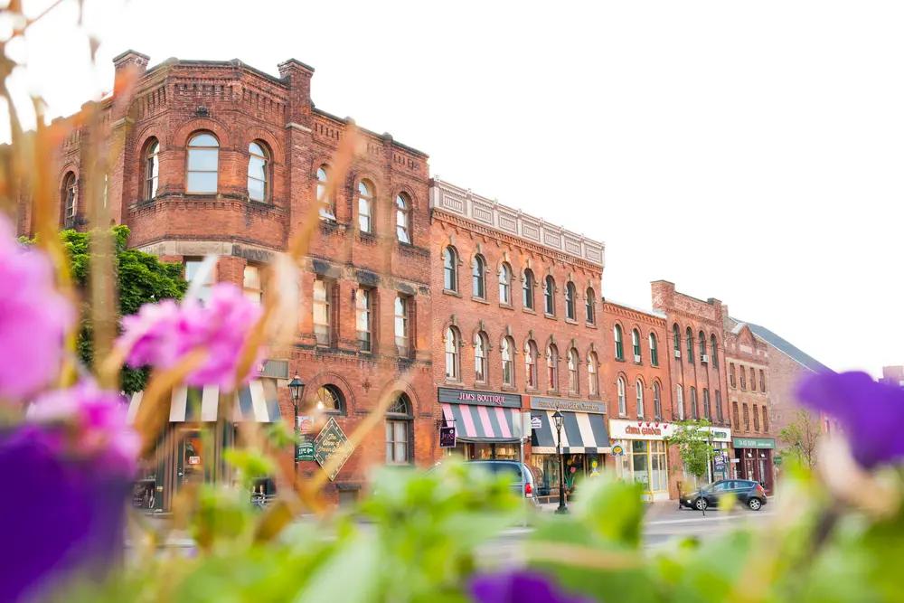 Historic brick storefronts and boutique shops along a downtown street in Charlottetown, Prince Edward Island