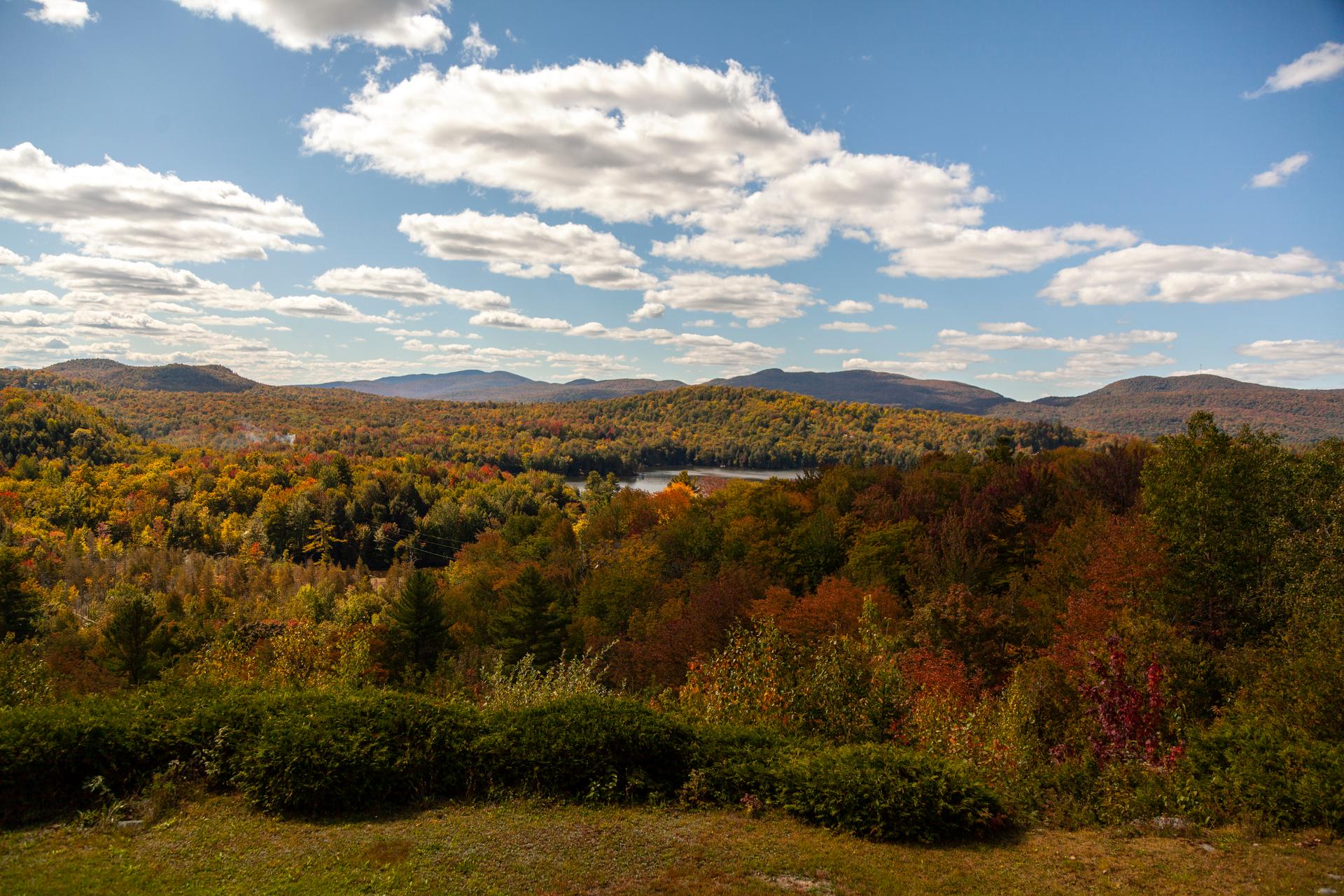 Rolling forested hills in fall colour along the International Appalachian Trail's route through the Gaspé Peninsula, Québec