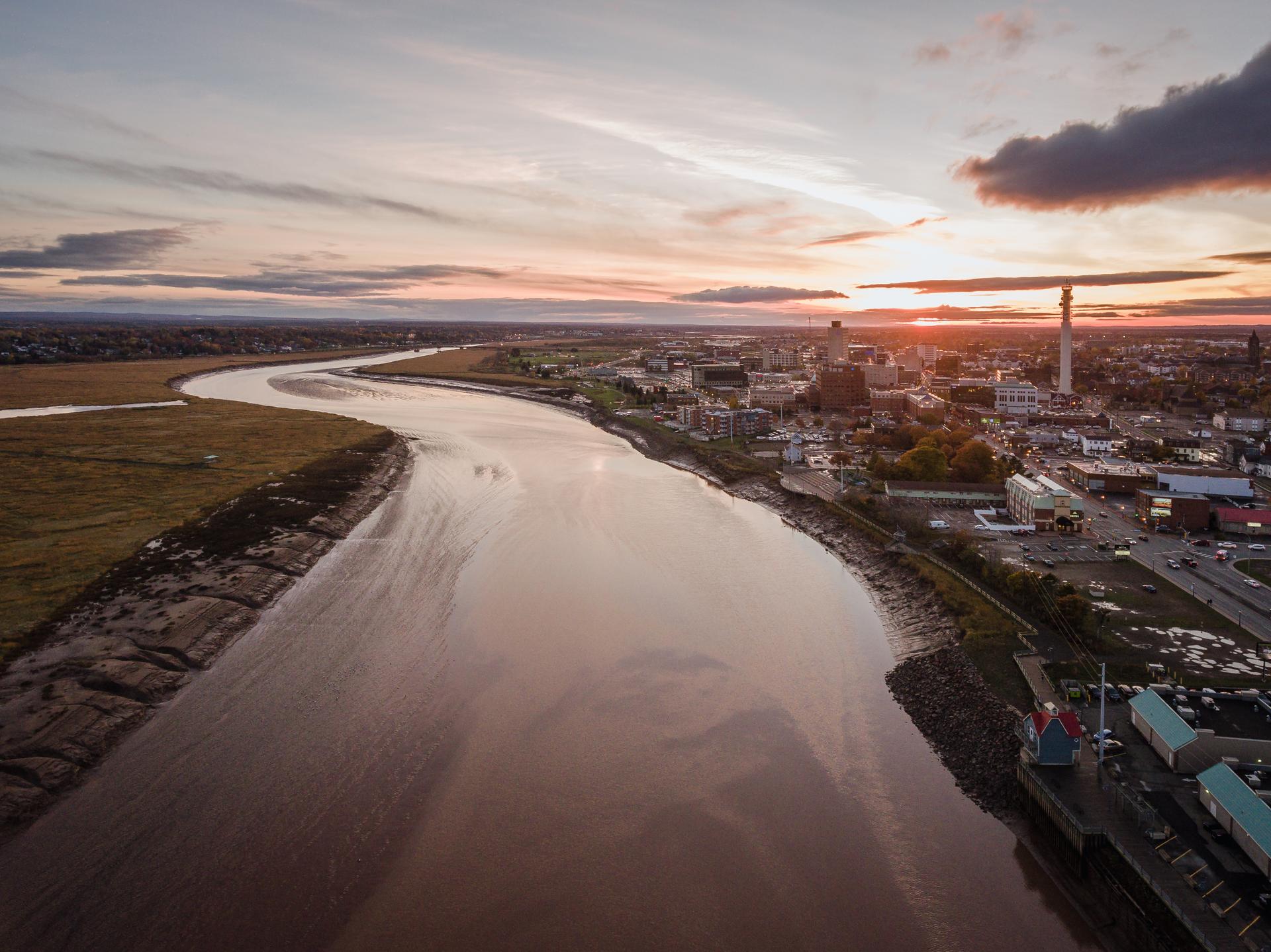 Aerial view of Moncton, New Brunswick, on the Bay of Fundy, where the Petitcodiac River drains to mudflats at low tide near downtown.