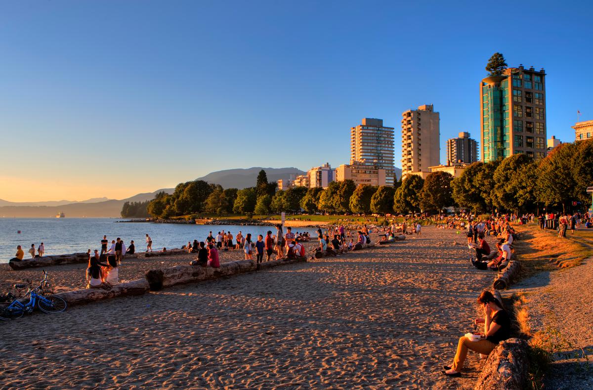 people hanging out at English Bay in Vancouver