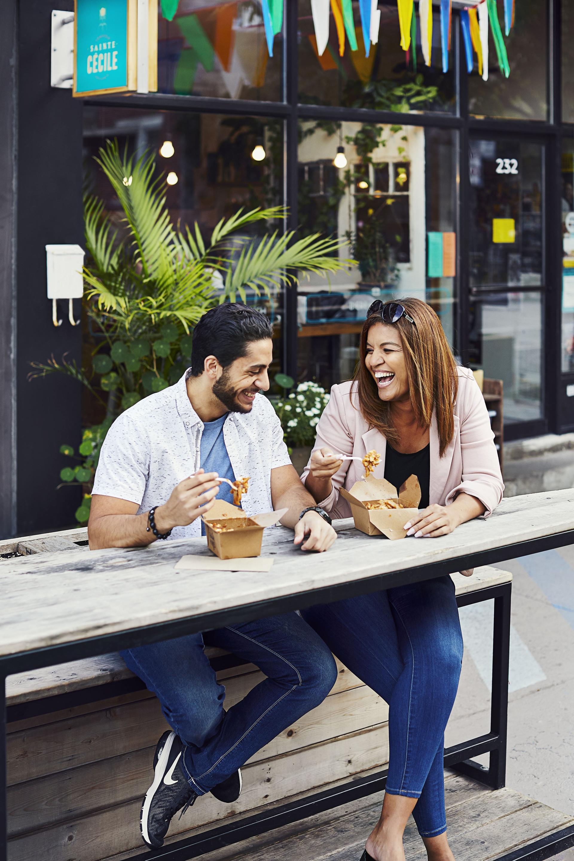 Photo of two people eating in Montreal