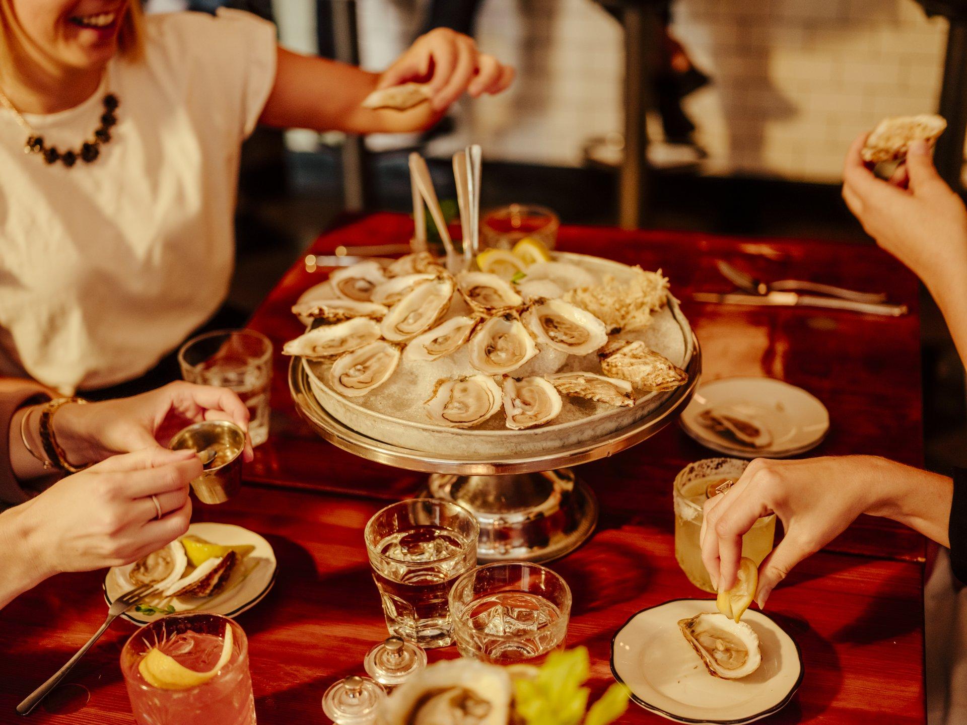 People eating fresh oysters