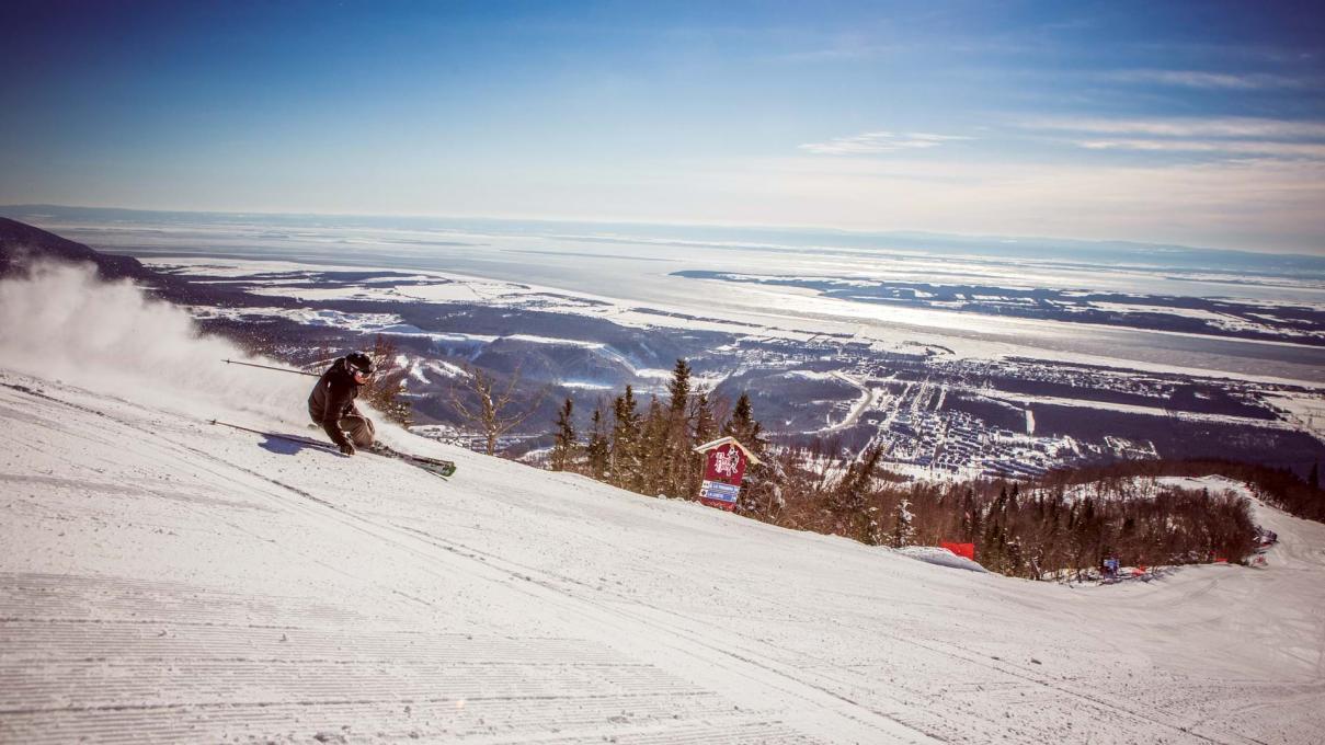 a person skiing down a hill in Quebec