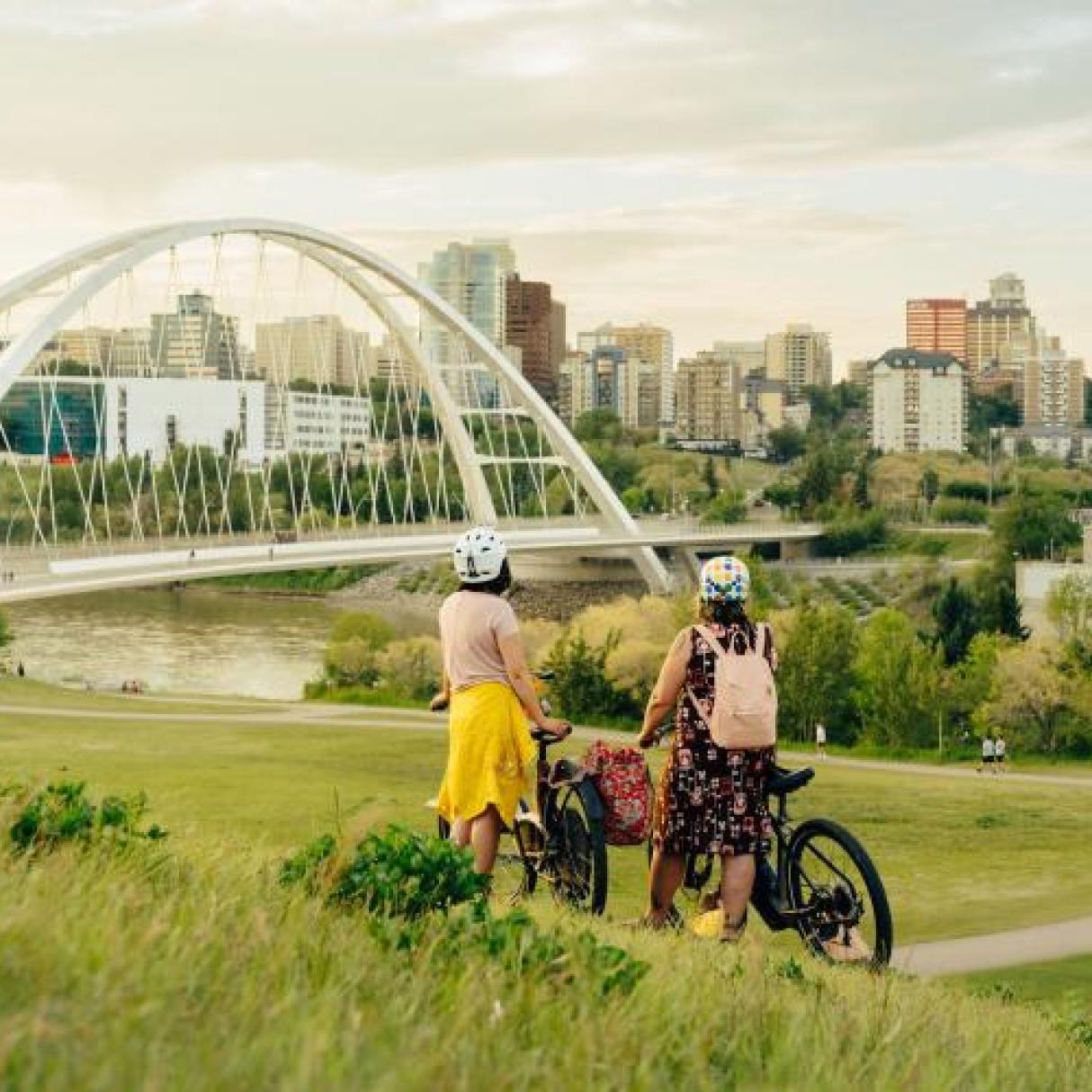 Two cyclists look at Edmonton's Walterdale Bridge